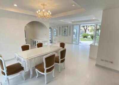 Elegant dining room with chandelier and garden view