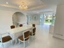 Elegant dining room with chandelier and garden view