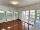 Spacious bedroom with built-in wardrobes and large windows