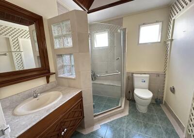 Bathroom with shower, toilet, and sink