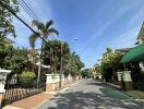 Street view of residential neighborhood with clear sky