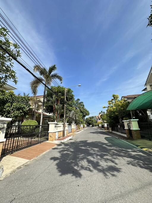 Street view of residential neighborhood with clear sky