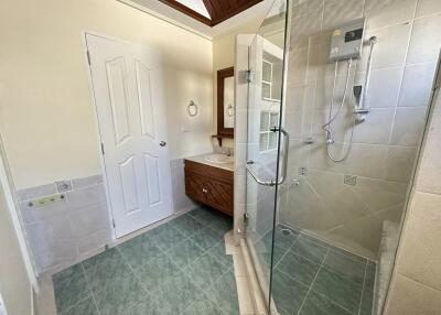 Modern bathroom with glass shower and vanity