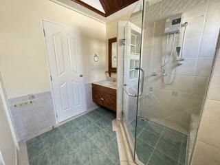 Modern bathroom with glass shower and vanity