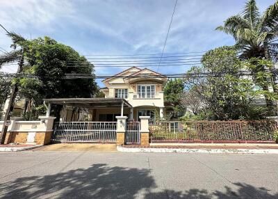 Front view of a residential house with a yard