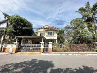 Front view of a residential house with a yard