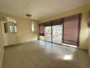 Spacious living room with large windows and sliding glass door