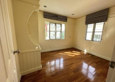 Bright bedroom with hardwood flooring