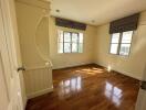 Bright bedroom with hardwood flooring