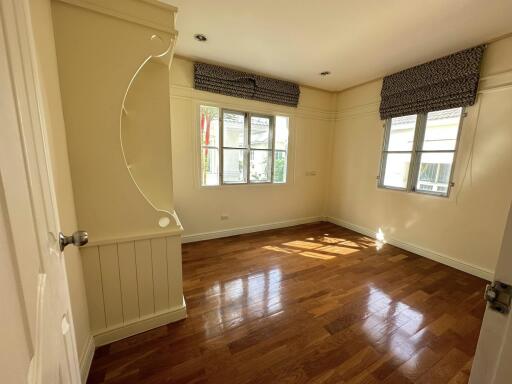 Bright bedroom with hardwood flooring