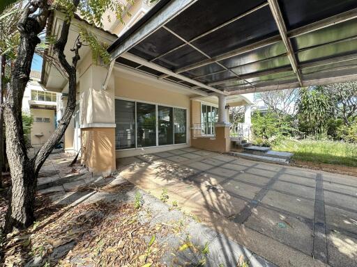 Covered patio with glass doors and garden view