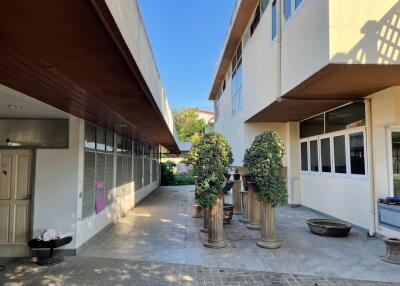 Exterior view of a building with potted plants