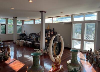 Spacious and well-lit living room with traditional decor