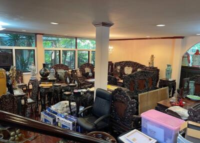 Room with eclectic antique furniture and decorative items