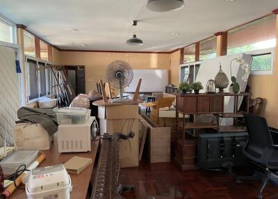 Living space filled with various items and furniture