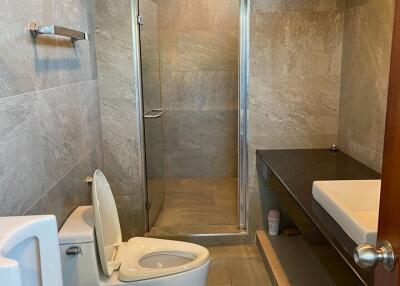 Modern bathroom with glass shower and toilet