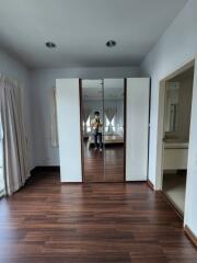 Bedroom with mirrored wardrobe