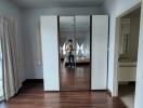 Bedroom with mirrored wardrobe