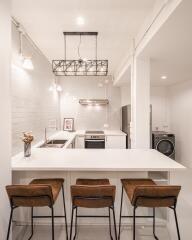 Modern kitchen with island counter and bar stools