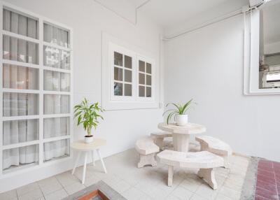 Outdoor patio with plant decor and seating