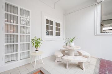 Outdoor patio with plant decor and seating