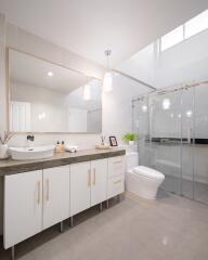 Modern bathroom with large mirror and shower