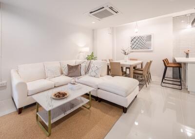 Modern living room with dining area and a small kitchen