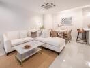 Modern living room with dining area and a small kitchen