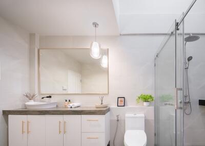 Modern bathroom with glass shower and vanity