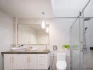 Modern bathroom with glass shower and vanity