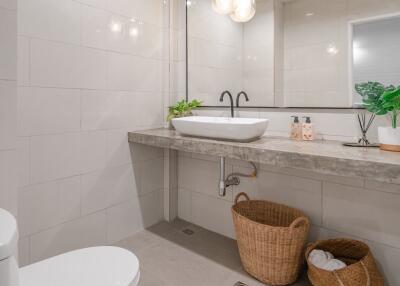 Modern bathroom with large mirror and vanity