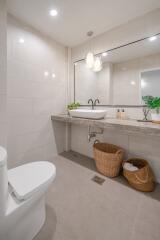 Modern bathroom with large mirror and vanity