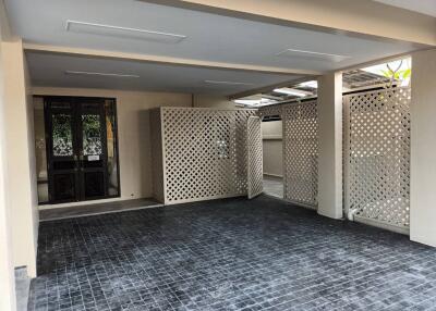 Spacious covered garage with lattice fencing