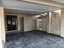 Spacious covered garage with lattice fencing