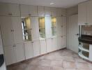 Spacious kitchen with ample cabinetry and built-in shelving