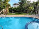 Outdoor swimming pool area with residential background