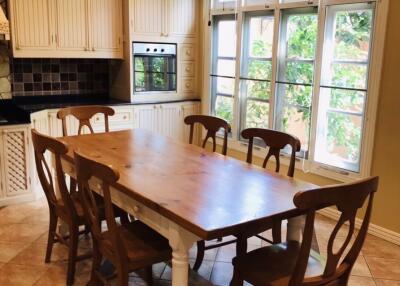 Cozy dining area with wooden table and chairs