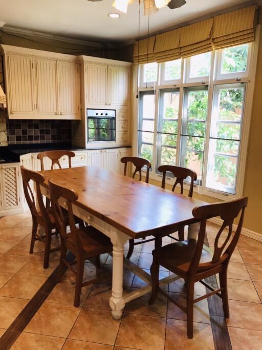 Cozy dining area with wooden table and chairs