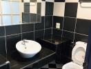 Bathroom with black and white checkered tiles