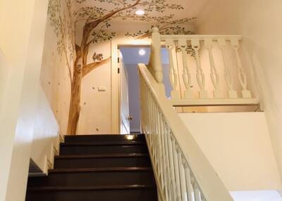 Staircase with decorative tree mural