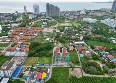 Aerial view of a residential area with buildings and greenery