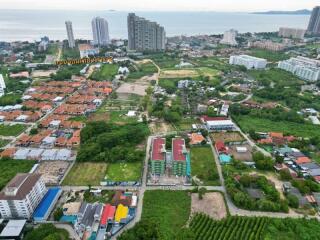 Aerial view of a residential area with buildings and greenery