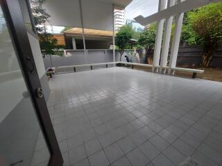 Spacious outdoor patio area with tiled flooring