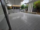 Spacious outdoor patio area with tiled flooring