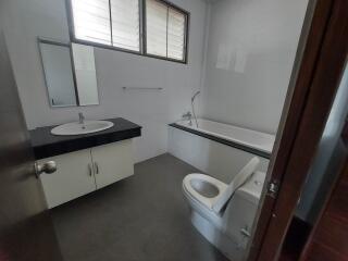 Modern bathroom with bathtub and toilet