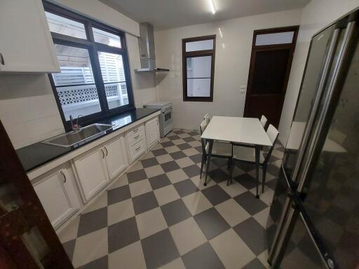 Modern kitchen with checkered floor