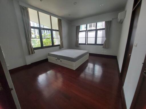 Bright bedroom with large windows