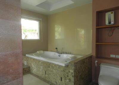 Modern bathroom with a built-in bathtub and a window