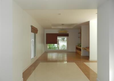 Spacious living room with large windows and ample natural light