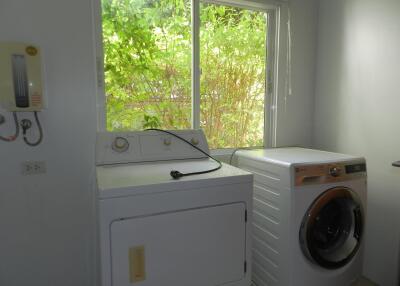 Laundry room with washing machine and dryer